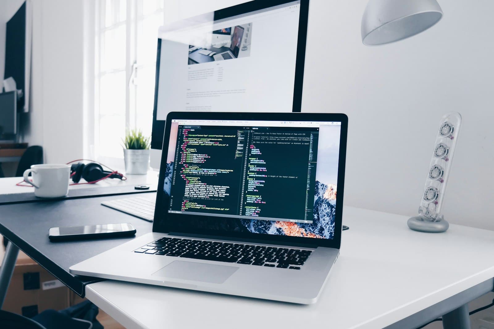 Developer working on cloud software at laptop